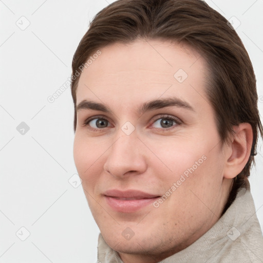 Joyful white young-adult female with short  brown hair and grey eyes