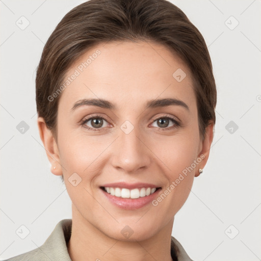 Joyful white young-adult female with short  brown hair and grey eyes