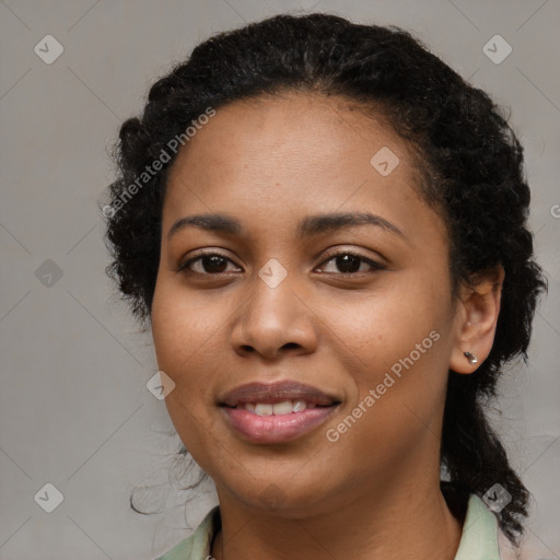 Joyful black young-adult female with medium  black hair and brown eyes