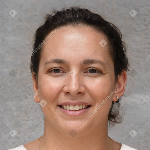 Joyful white adult female with short  brown hair and brown eyes