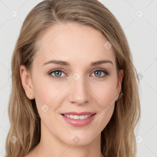 Joyful white young-adult female with long  brown hair and blue eyes