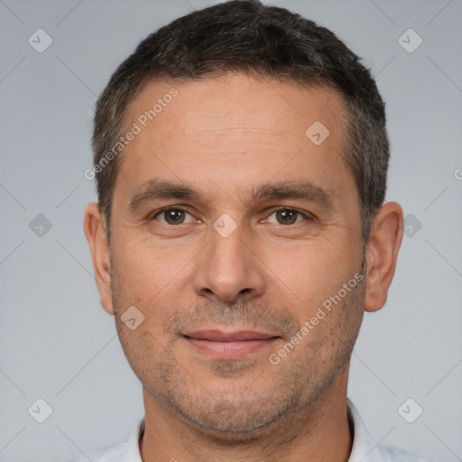 Joyful white adult male with short  brown hair and brown eyes