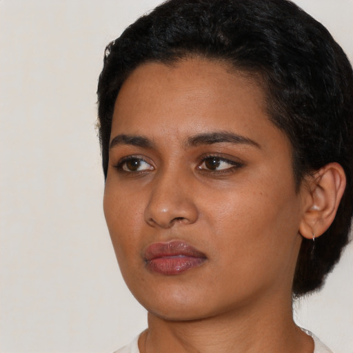Neutral latino young-adult female with short  black hair and brown eyes