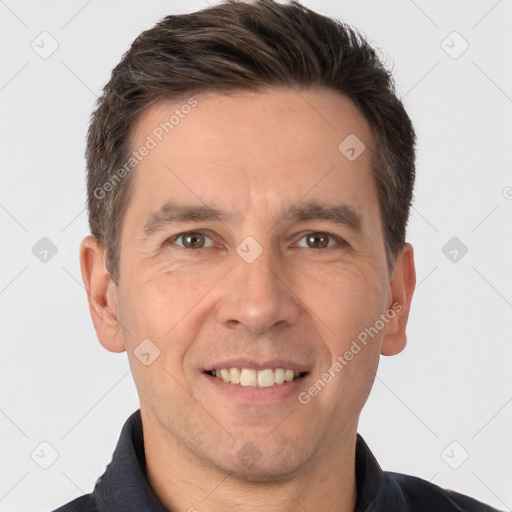 Joyful white adult male with short  brown hair and brown eyes