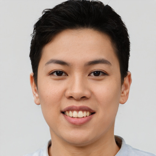 Joyful asian young-adult female with short  brown hair and brown eyes