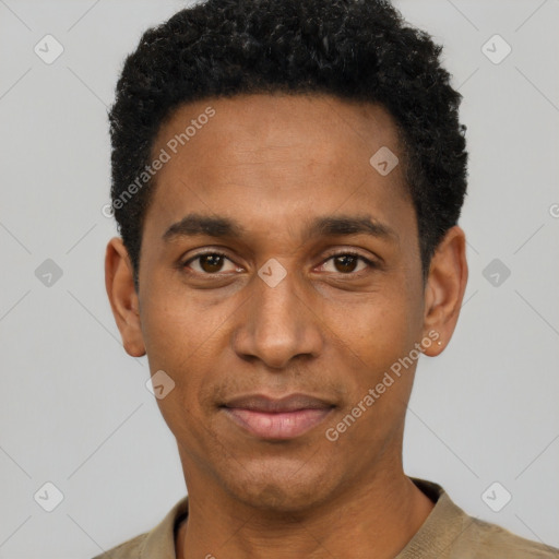 Joyful black young-adult male with short  black hair and brown eyes