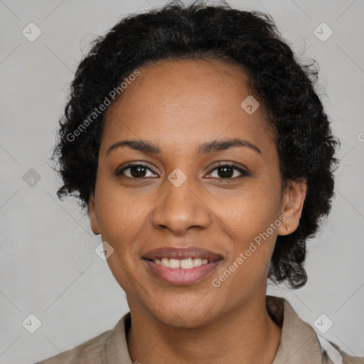 Joyful black young-adult female with short  brown hair and brown eyes