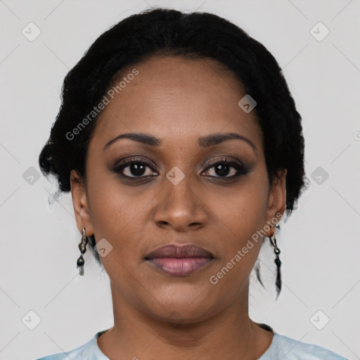 Joyful black young-adult female with short  black hair and brown eyes