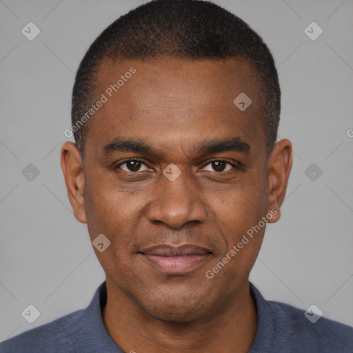 Joyful black young-adult male with short  brown hair and brown eyes