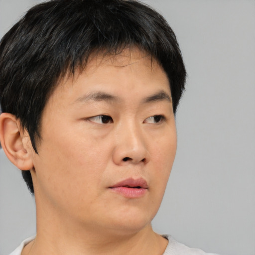 Neutral asian young-adult male with short  brown hair and brown eyes