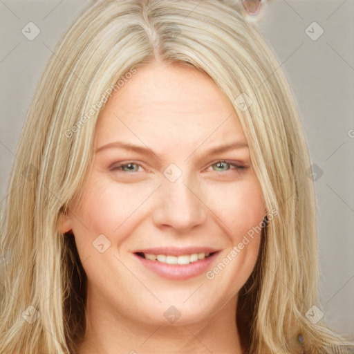 Joyful white young-adult female with long  blond hair and blue eyes