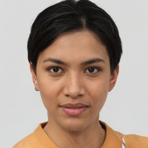 Joyful asian young-adult female with short  brown hair and brown eyes
