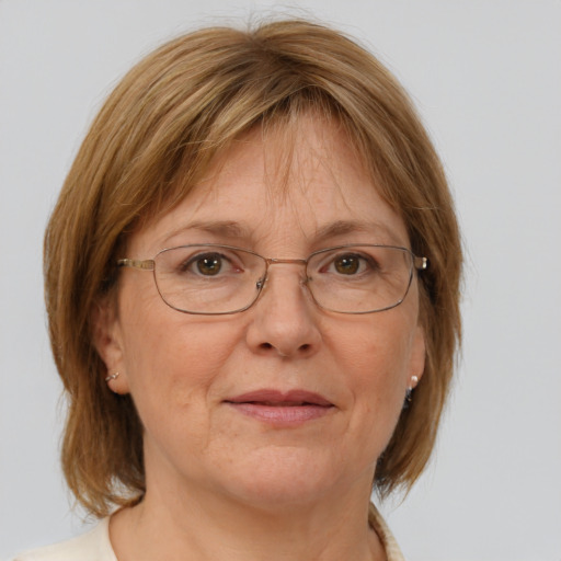 Joyful white middle-aged female with medium  brown hair and blue eyes