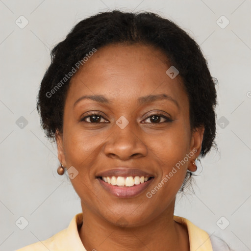 Joyful black adult female with medium  brown hair and brown eyes