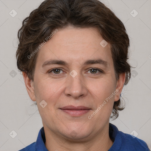 Joyful white adult female with short  brown hair and brown eyes