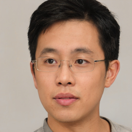 Neutral asian young-adult male with short  brown hair and brown eyes