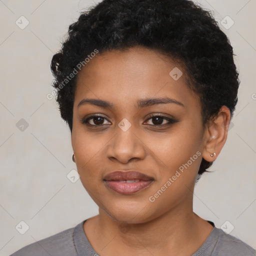 Joyful black young-adult female with short  black hair and brown eyes