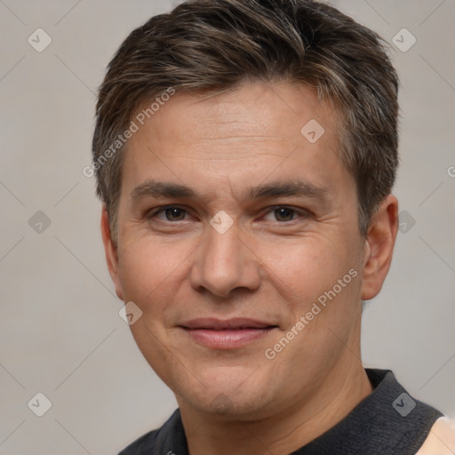 Joyful white adult male with short  brown hair and brown eyes