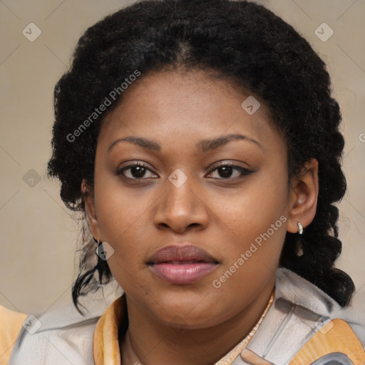 Joyful black young-adult female with long  brown hair and brown eyes