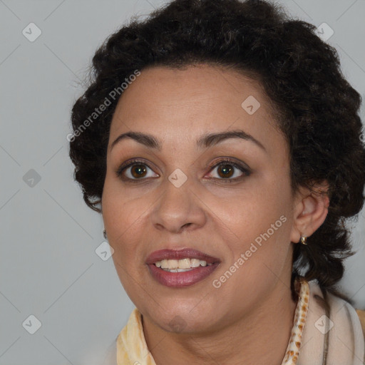 Joyful black adult female with short  brown hair and brown eyes