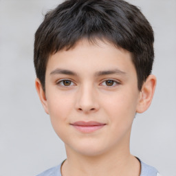 Joyful white child male with short  brown hair and brown eyes