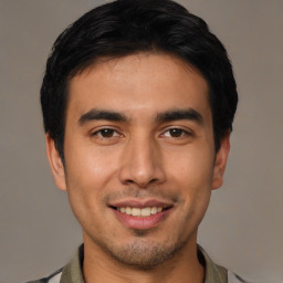 Joyful asian young-adult male with short  black hair and brown eyes