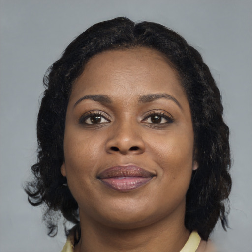 Joyful black young-adult female with medium  brown hair and brown eyes