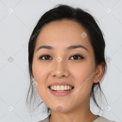 Joyful white young-adult female with medium  black hair and brown eyes