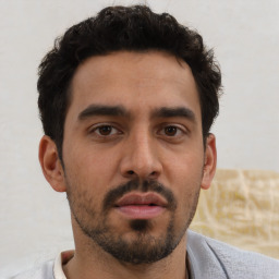 Neutral white young-adult male with short  black hair and brown eyes