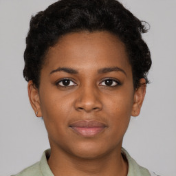 Joyful black young-adult female with short  brown hair and brown eyes