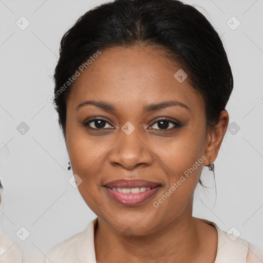 Joyful black young-adult female with medium  brown hair and brown eyes