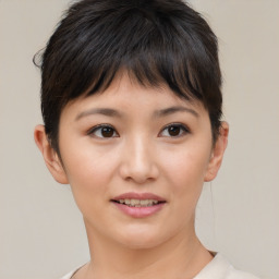 Joyful asian young-adult female with short  brown hair and brown eyes