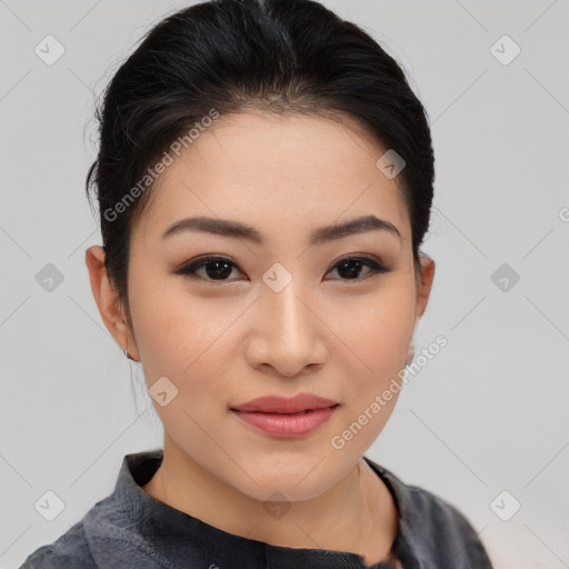 Joyful asian young-adult female with short  brown hair and brown eyes