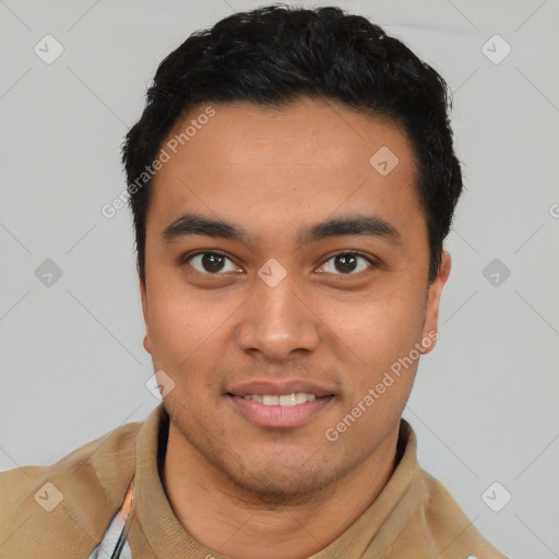 Joyful latino young-adult male with short  black hair and brown eyes