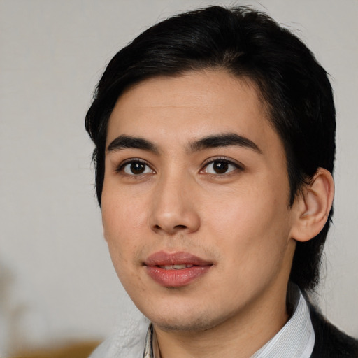 Joyful asian young-adult male with medium  black hair and brown eyes