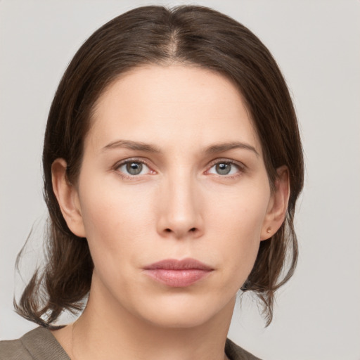 Neutral white young-adult female with medium  brown hair and grey eyes