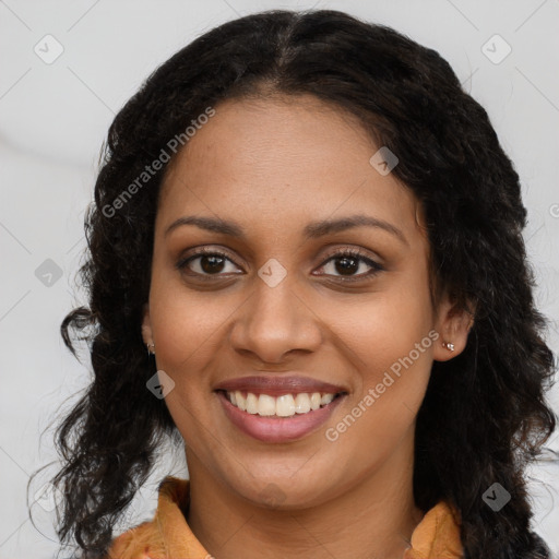 Joyful black young-adult female with long  brown hair and brown eyes