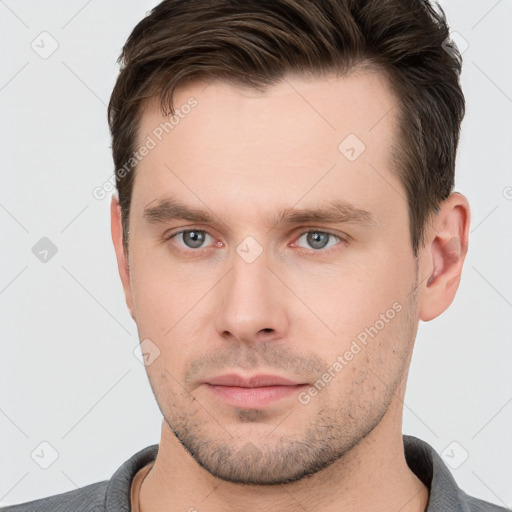 Neutral white young-adult male with short  brown hair and brown eyes