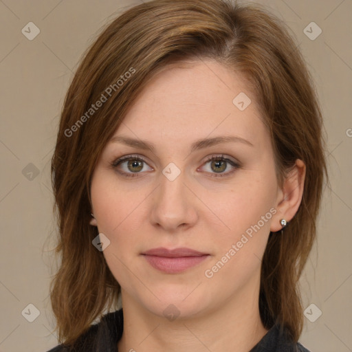 Joyful white young-adult female with long  brown hair and green eyes