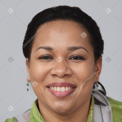 Joyful black adult female with short  brown hair and brown eyes