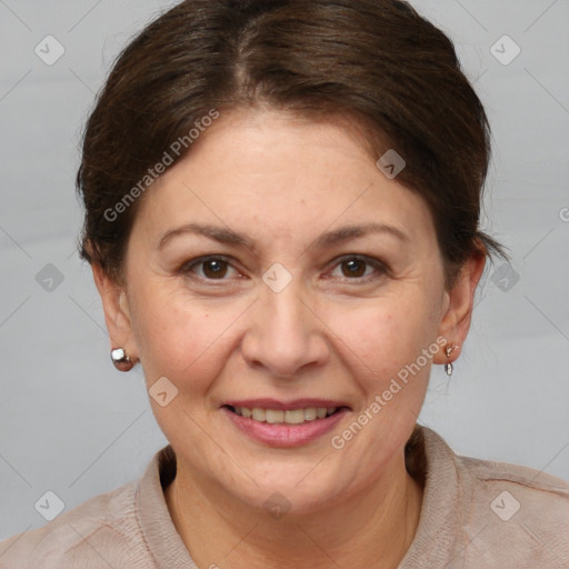 Joyful white adult female with short  brown hair and brown eyes