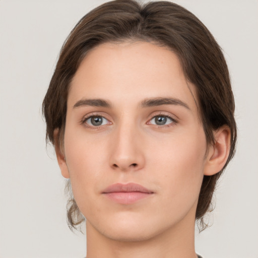 Neutral white young-adult female with medium  brown hair and brown eyes