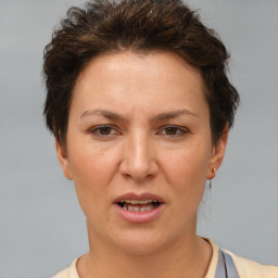 Joyful white adult female with short  brown hair and brown eyes