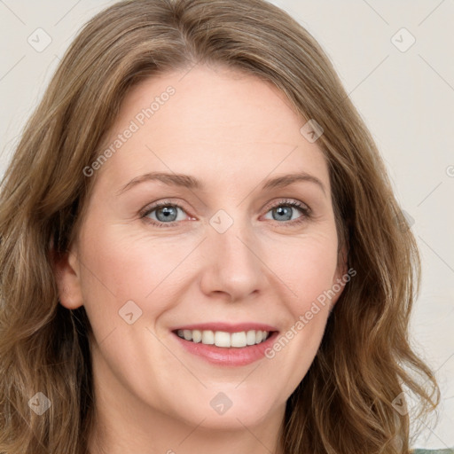 Joyful white young-adult female with long  brown hair and green eyes