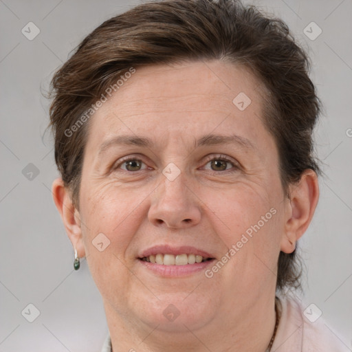 Joyful white adult female with short  brown hair and grey eyes