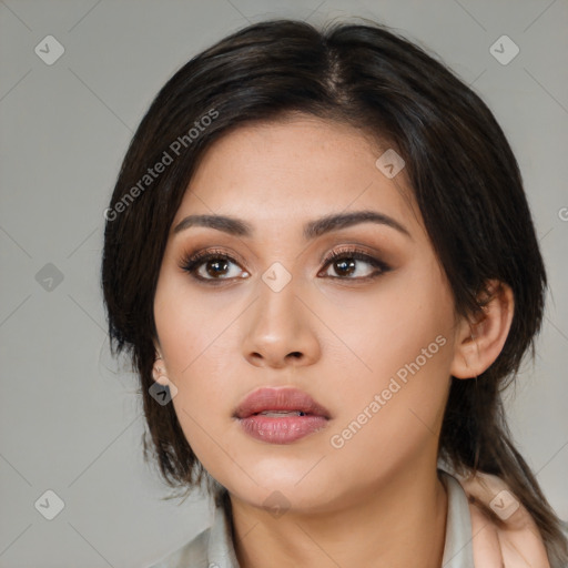 Neutral asian young-adult female with medium  brown hair and brown eyes