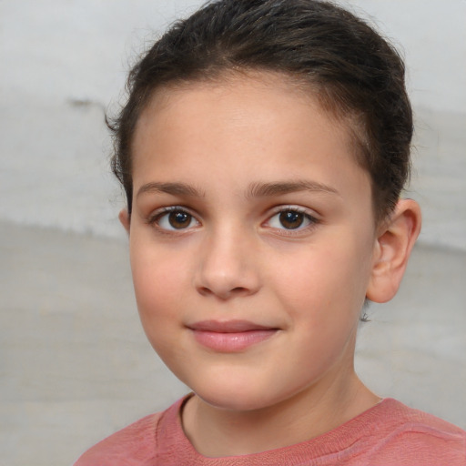 Joyful white child female with short  brown hair and brown eyes