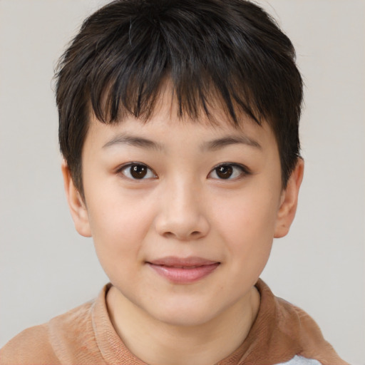 Joyful asian child female with short  brown hair and brown eyes