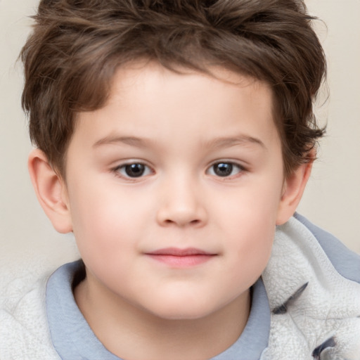 Joyful white child male with short  brown hair and brown eyes