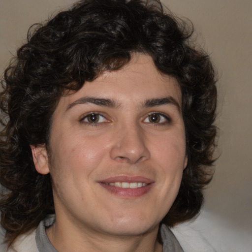 Joyful white young-adult male with medium  brown hair and brown eyes